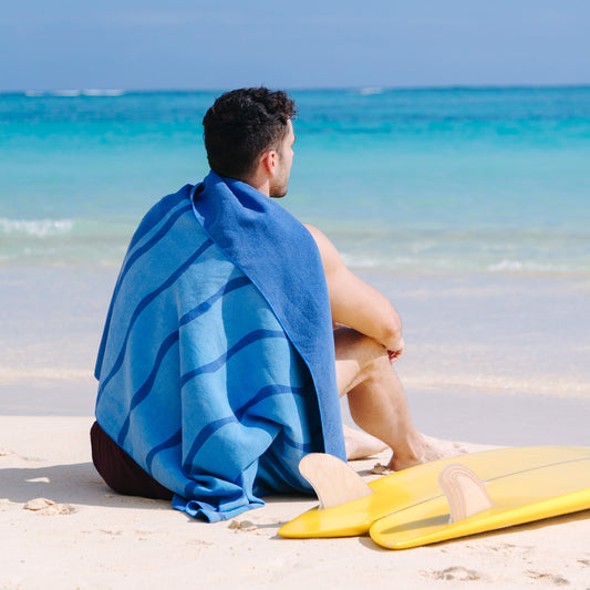 A man in a swimsuit with Seaview’s Akumal Beach Towel